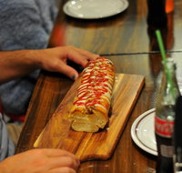 Paesano's Pizzeria with Double Dogs - Mentone - Accommodation Batemans Bay
